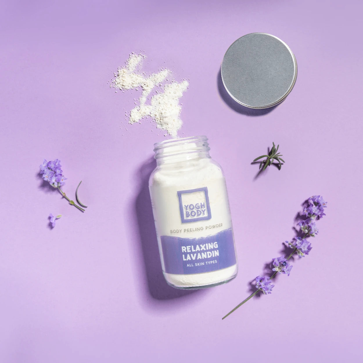 yogh body peeling powder with main ingredient lavender on purple background