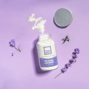 yogh body peeling powder with main ingredient lavender on purple background