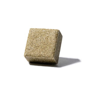 yogh hair fortifying vegan shampoo bar with horsetail and rosemary outside of box on white background