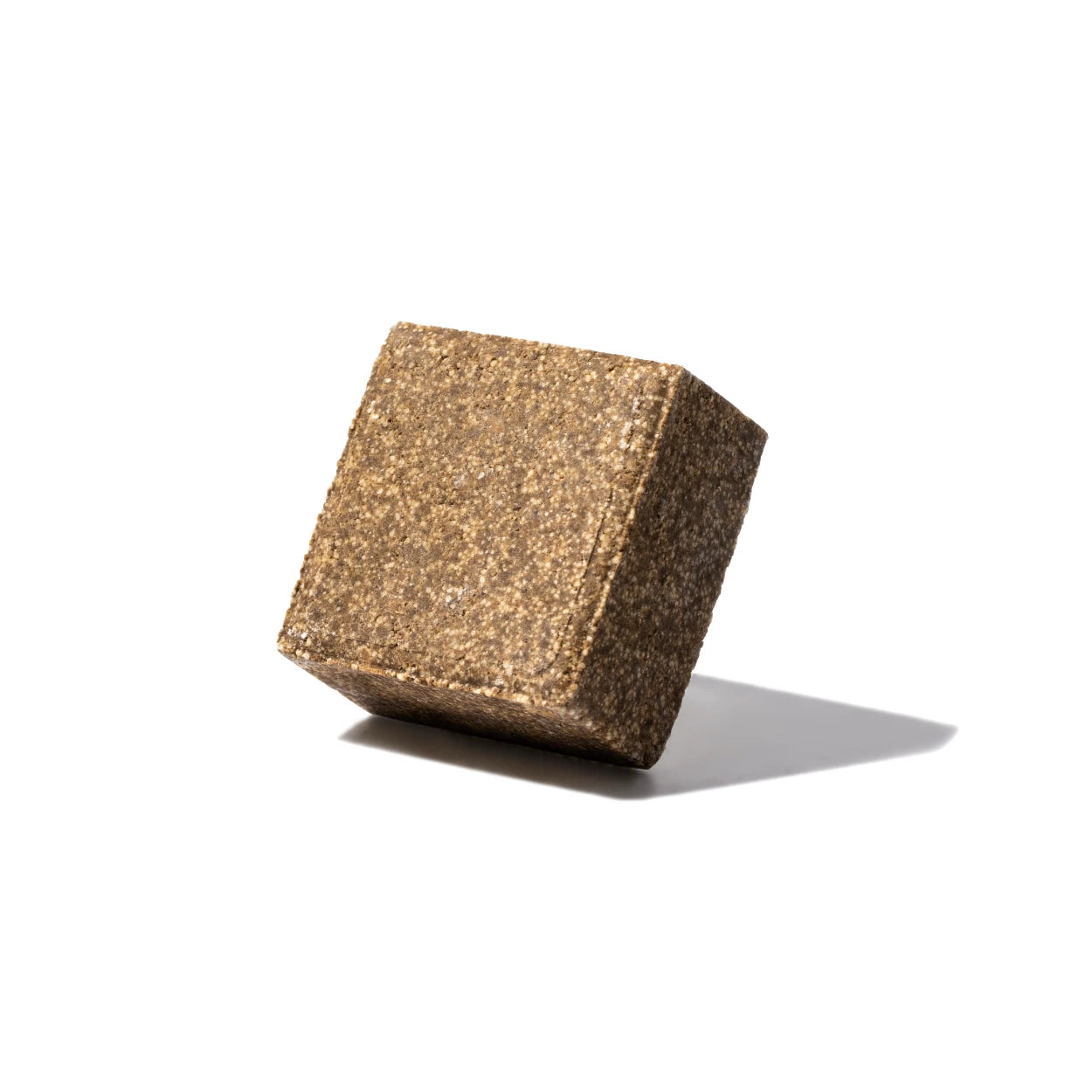 yogh hair volume and shine vegan shampoo bar with amla and orange outside of box on white background