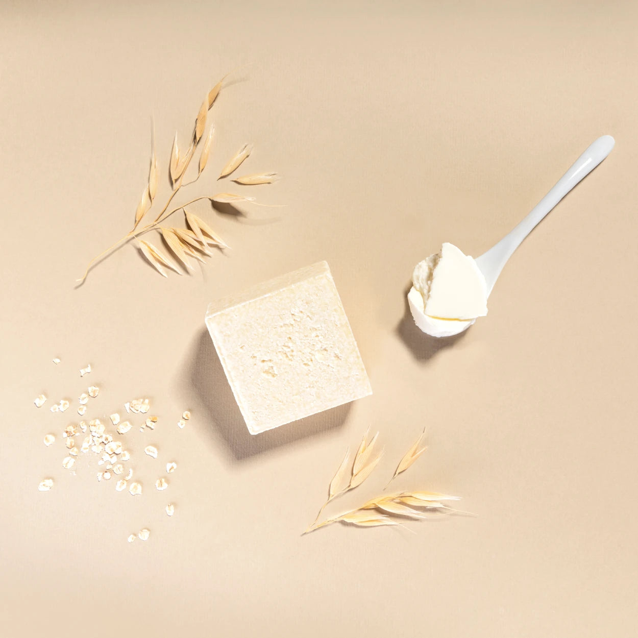 yogh hair baby shampoo bar with yoghurt and oats on beige background with its ingredients