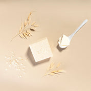 yogh hair baby shampoo bar with yoghurt and oats on beige background with its ingredients