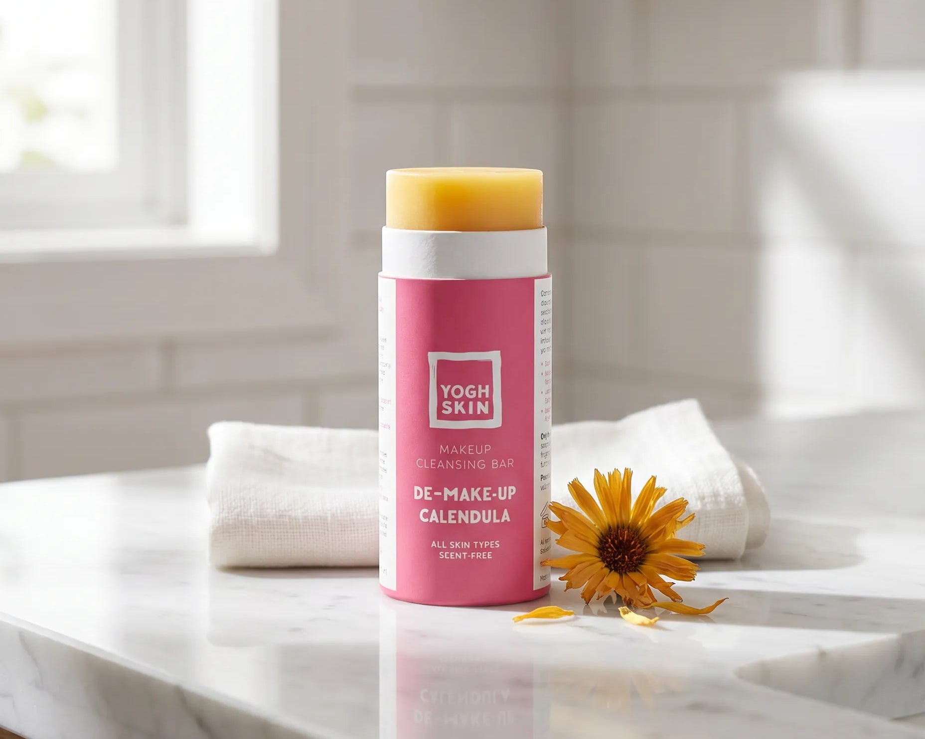 demakeup bar on a bathroom top next to a little calendula flower