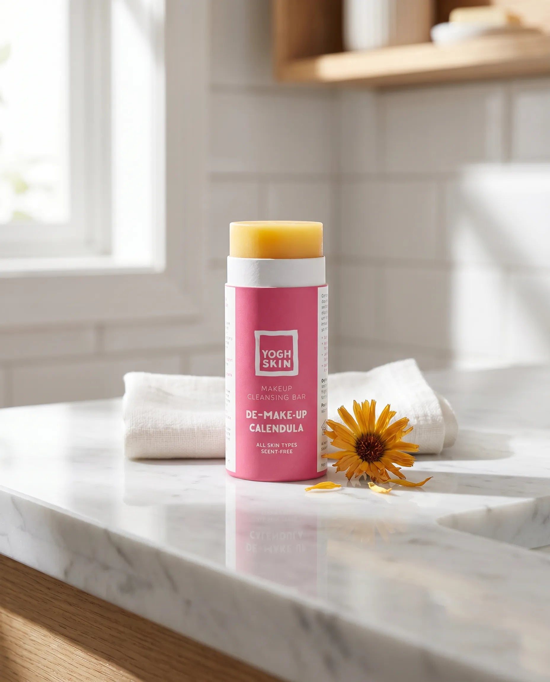 demakeup bar on a bathroom top next to a little calendula flower