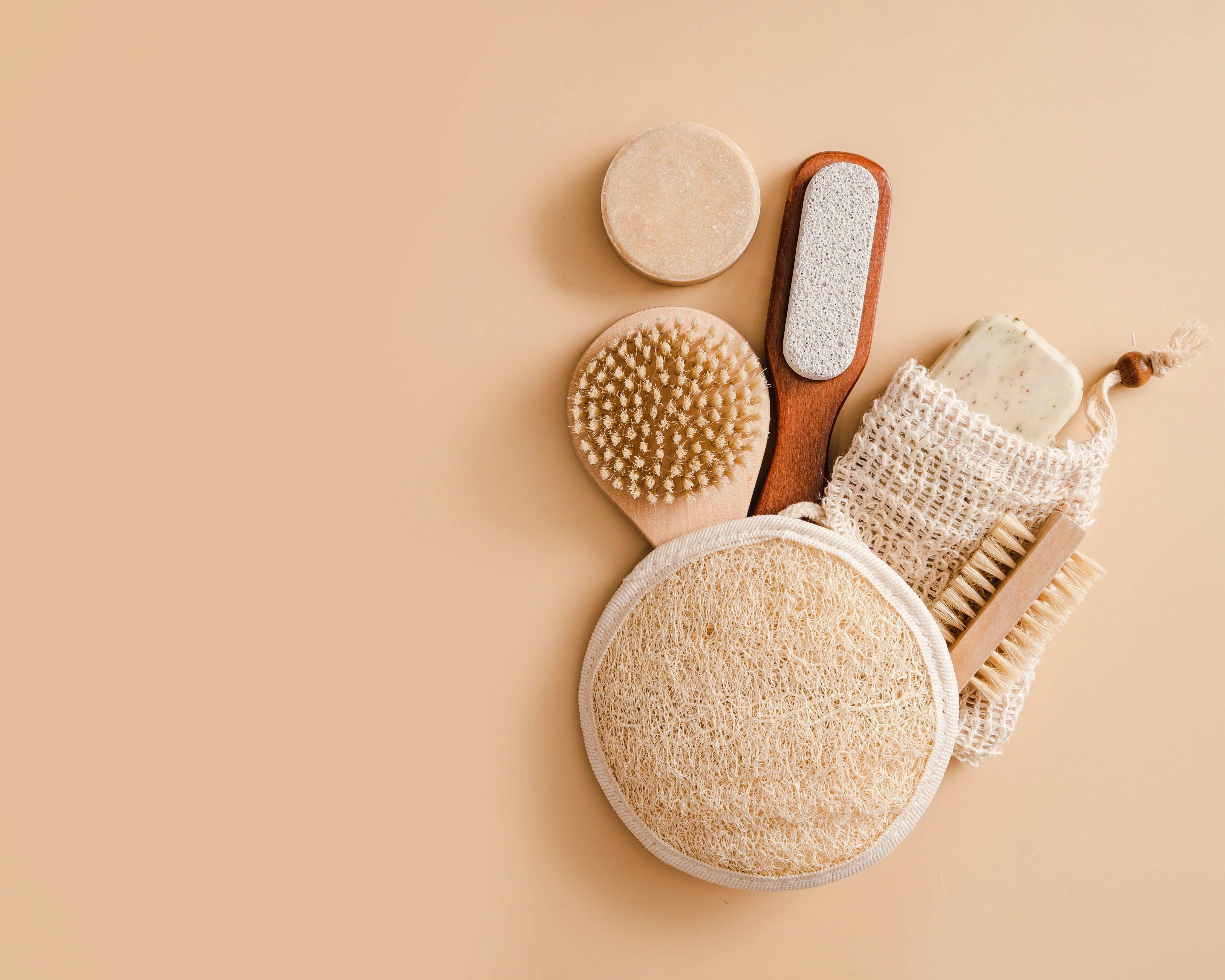 bathroom accessories on beige background