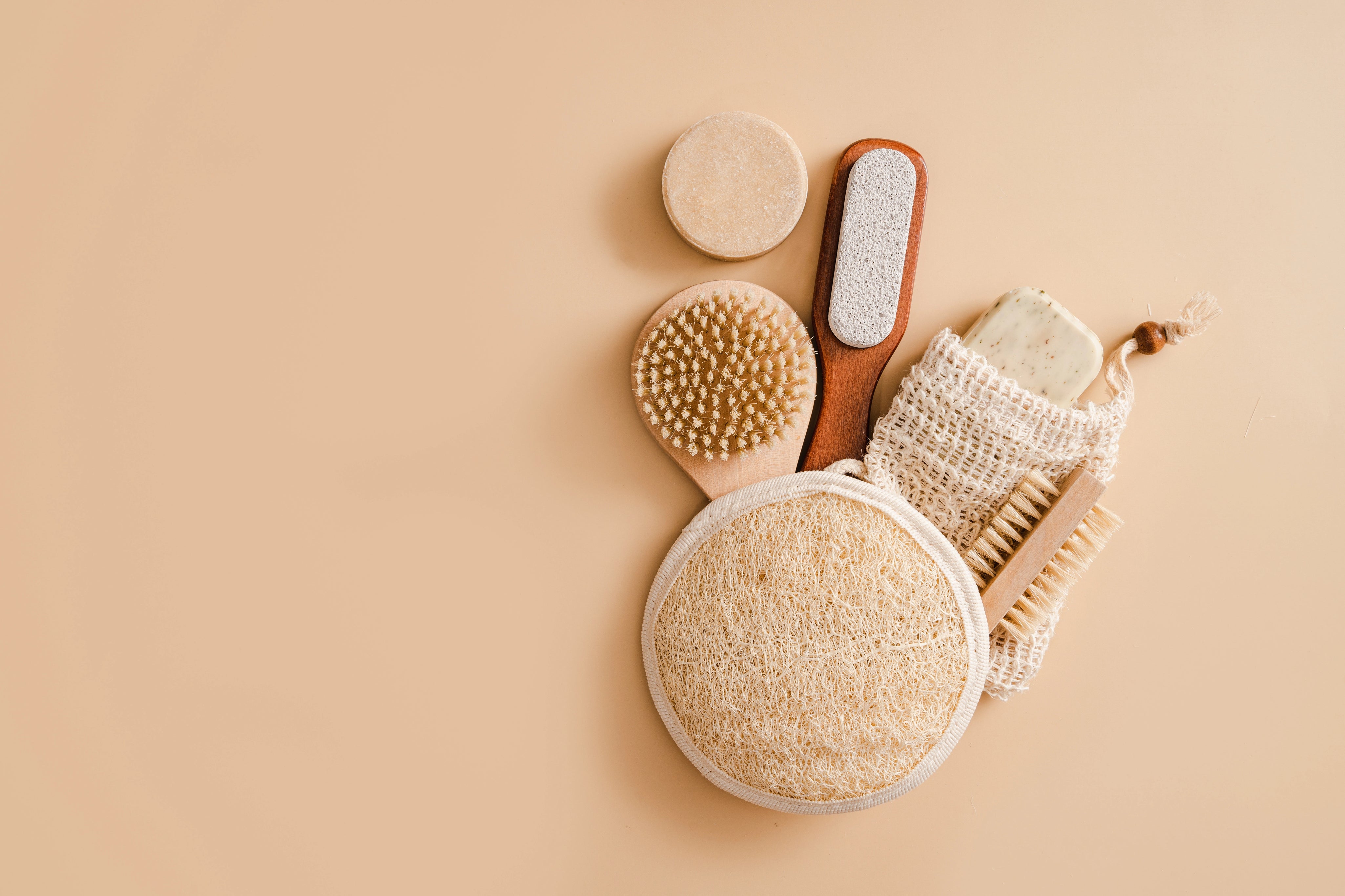 bathroom accessories on beige background