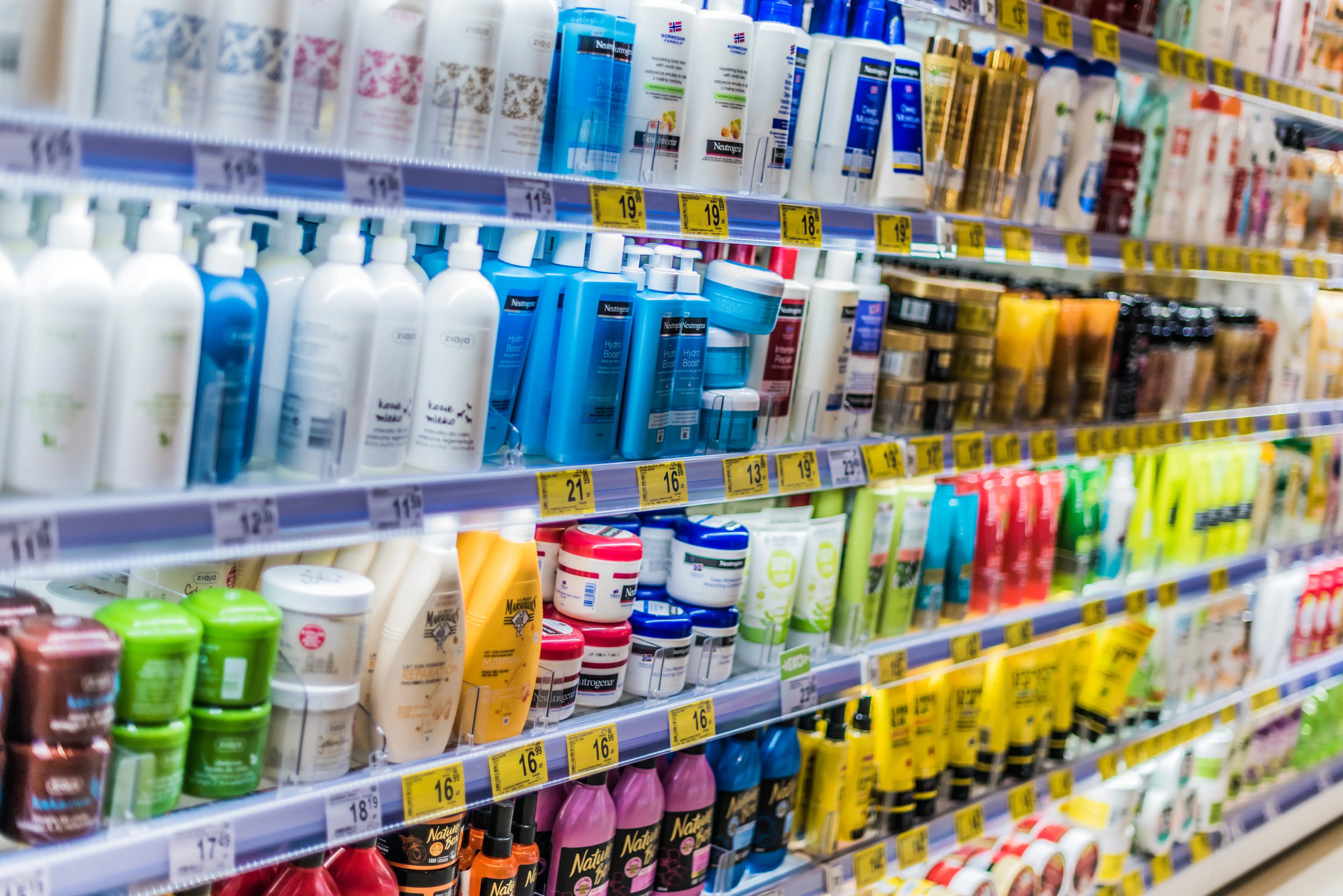 supermarket shelf full of cosmetics product in plastic packaging