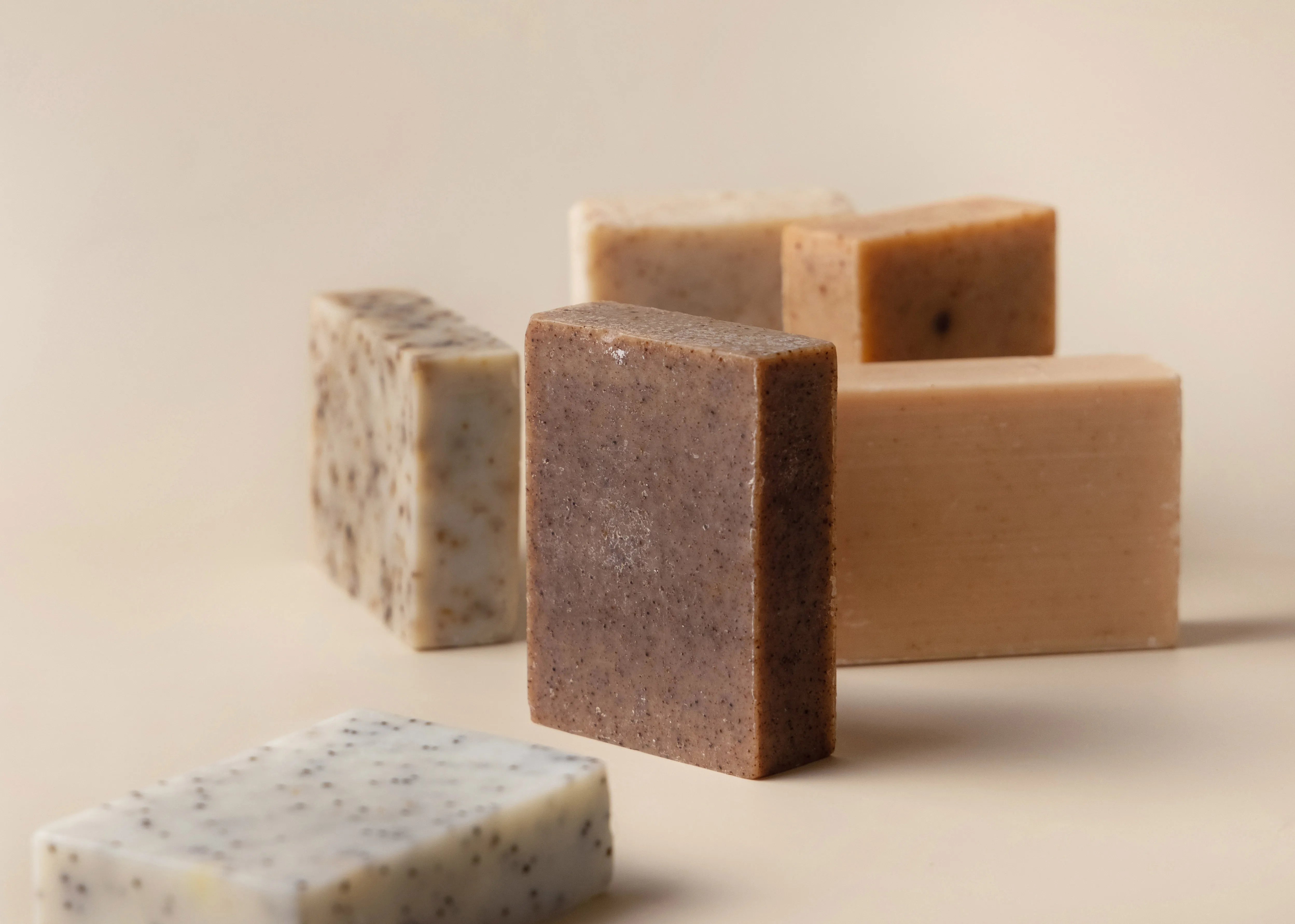 soap bars arranged on beige background