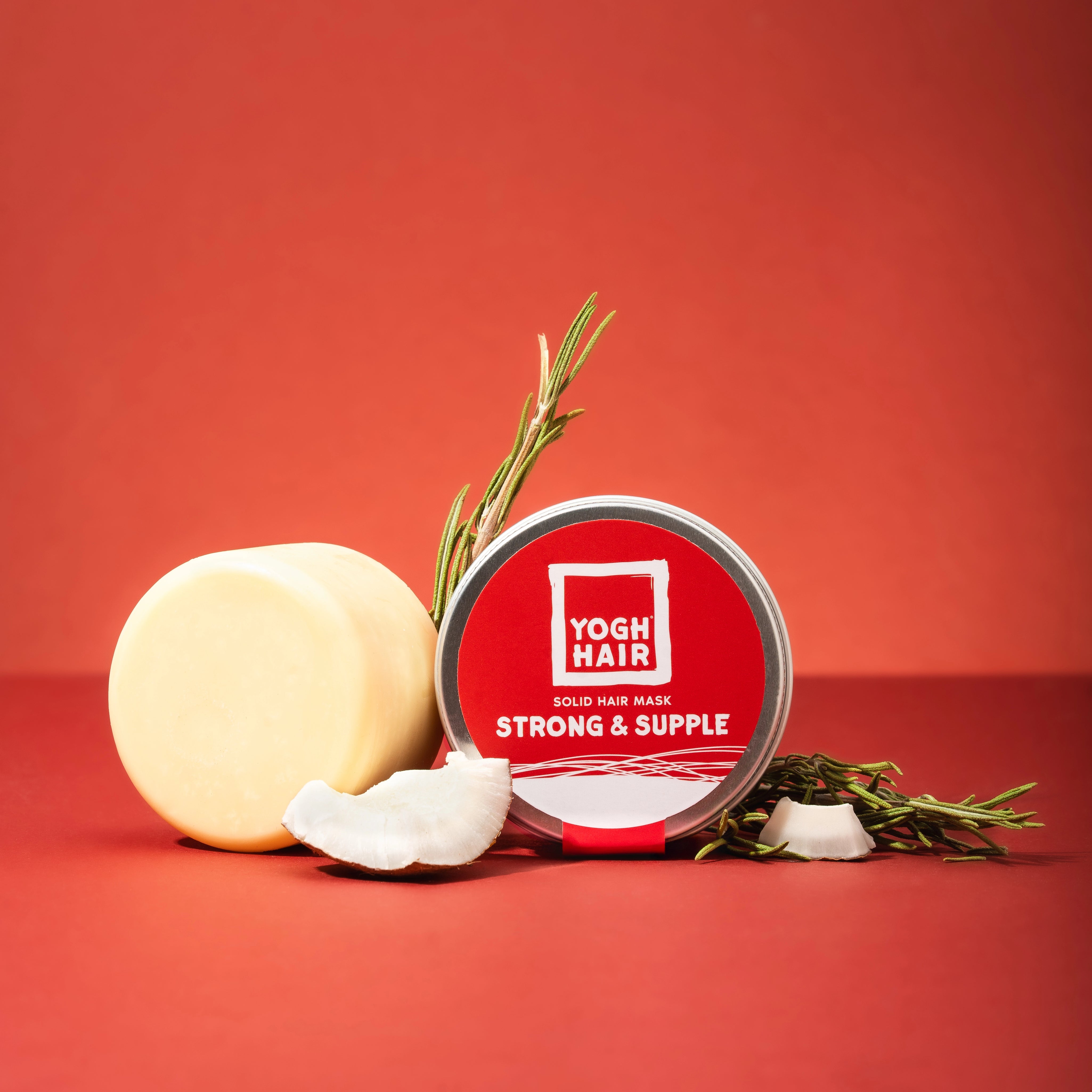 yoghhair strong and supple hair mask with its active ingredients on red background